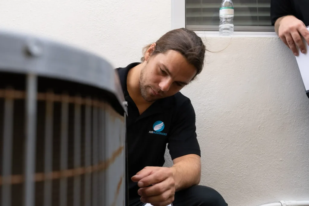 A long haired AC technician from Air Mavericks